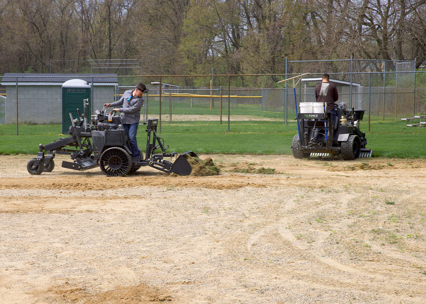 Ball field maintenance crew using Force Z-23 machines for infield grooming work 