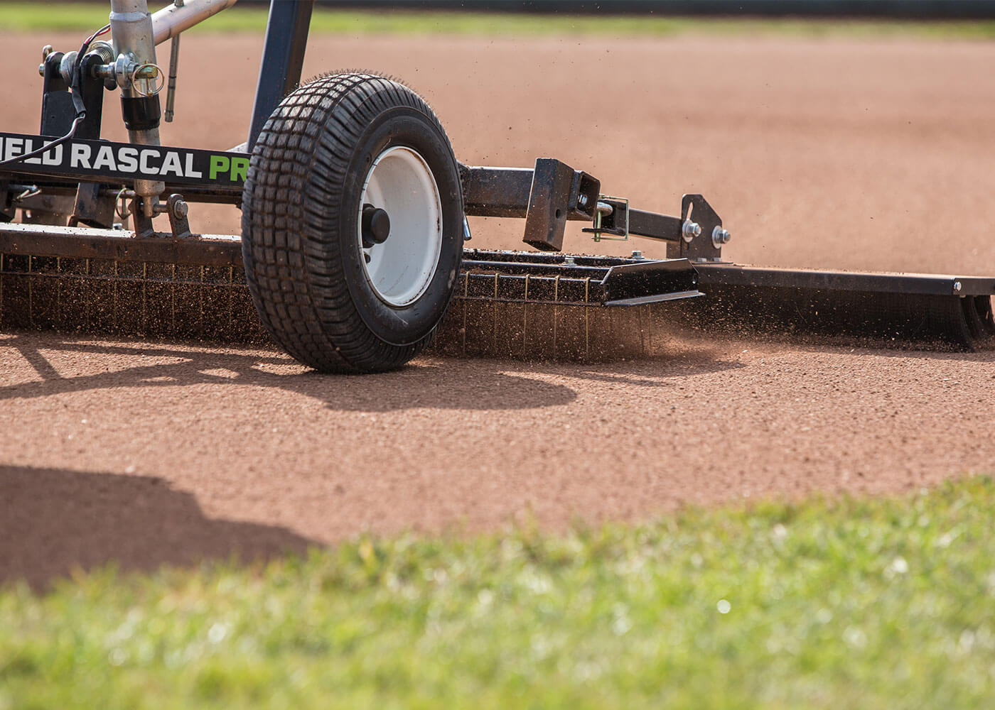 Infield rascal pro pull-behind groomer with final finish broom attachment on softball field 