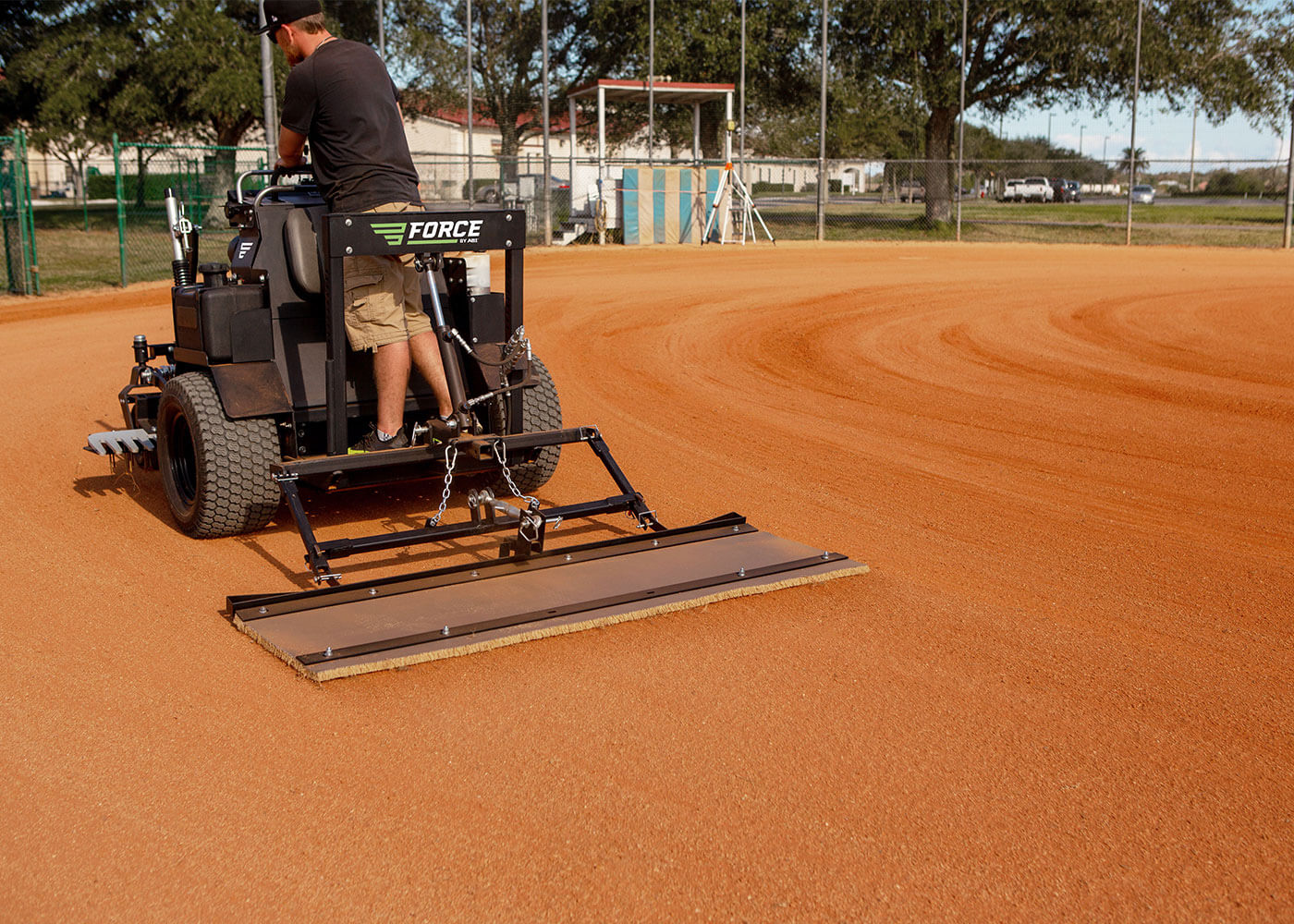 Force laser grader with coco mat attachment on softball field 