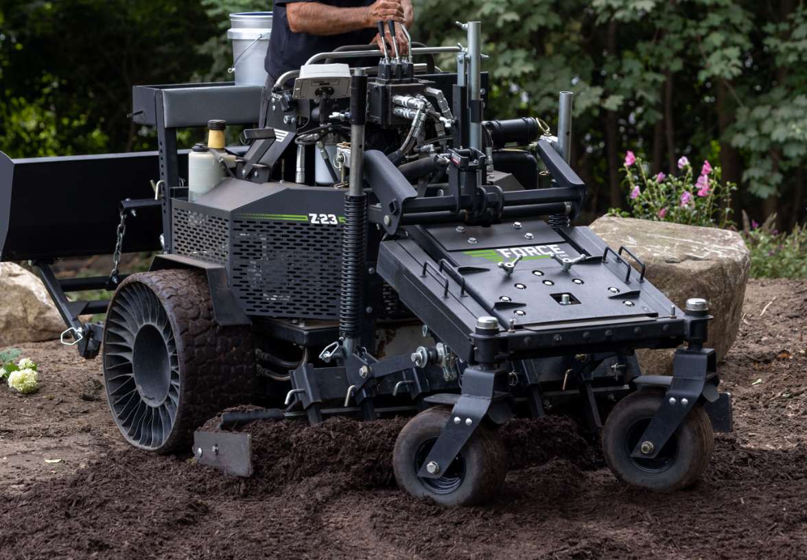 Force landscaping setup preparing dark dirt for lawn installation 